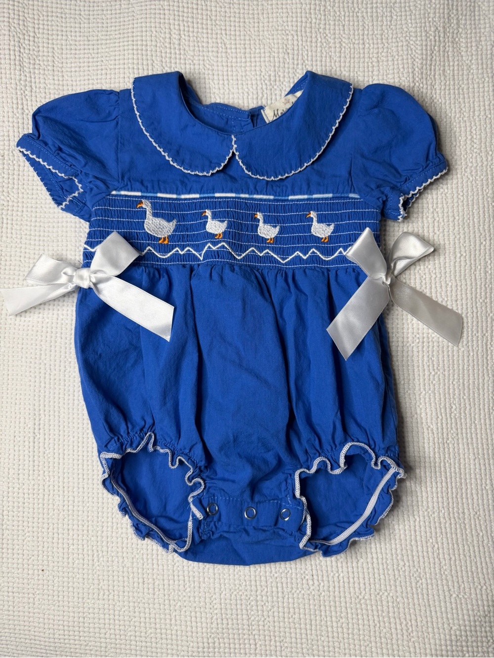 Smocked Royal Blue One-Piece Romper with White Satin Bows